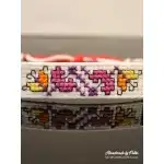 Martenitsa with pink embroidery